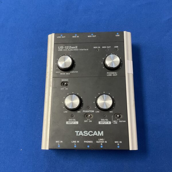 Tascam US-122mk2 audio interface with input and output connections.