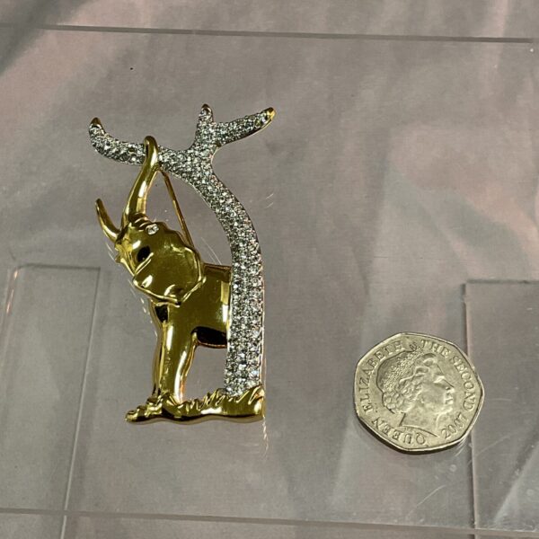 Swarovski elephant brooch with crystal tree, golden tone.