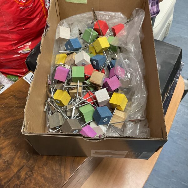 Colorful acrylic postit note holders for desk organization.