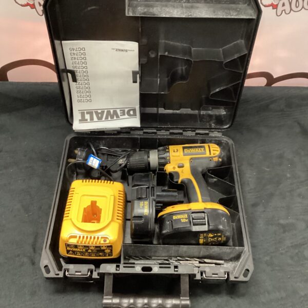 Dewalt DC731 cordless drill set with charger and case.