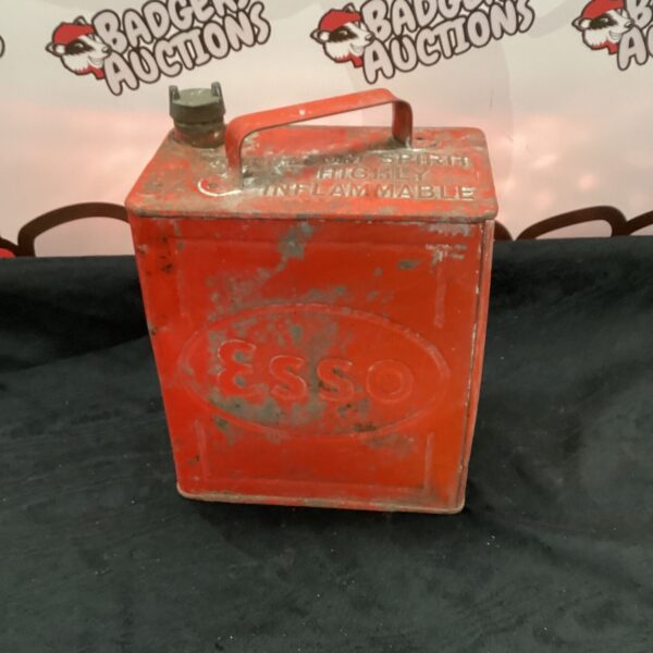 Vintage Esso fuel can, showing classic branding and signs of age.