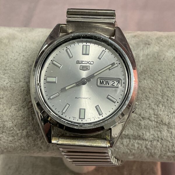 Close-up of vintage Seiko automatic watch with silver dial.