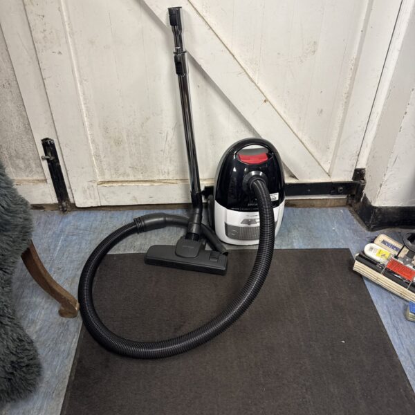 John Lewis portable cylinder vacuum cleaner in used condition.