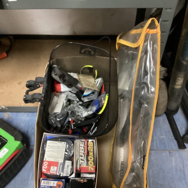 Overview of bicycle repair lot with inner tubes and tools.
