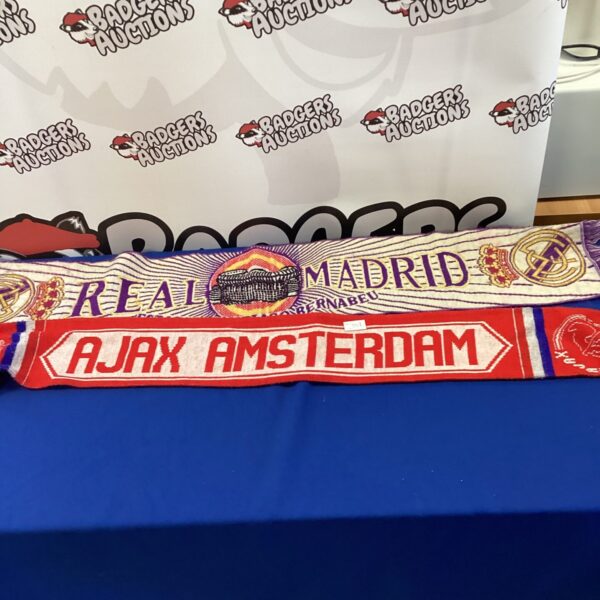 Two football scarves, Real Madrid and Ajax Amsterdam, displayed together.