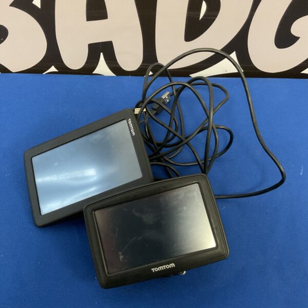 Two TomTom sat nav devices with cables for car navigation.