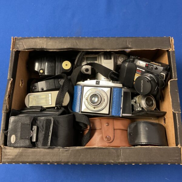 Vintage camera lot featuring an Olympus C4040 Zoom point and shoot camera.