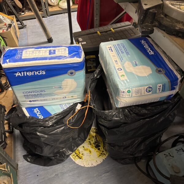 New lot of Attends incontinence pads in sealed packaging.