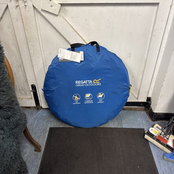 Closed Regatta two-berth pop up tent in blue and grey.