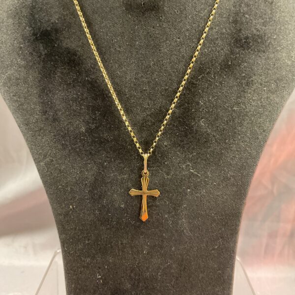 Delicate 9ct gold crucifix pendant on a 16 inch chain.