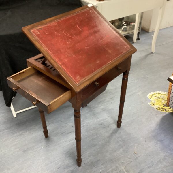 Vintage mahogany writing slope with burgundy leather surface.