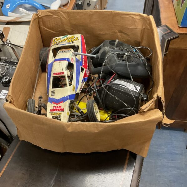 Vintage Team Hoppers RC car with remote control unit.