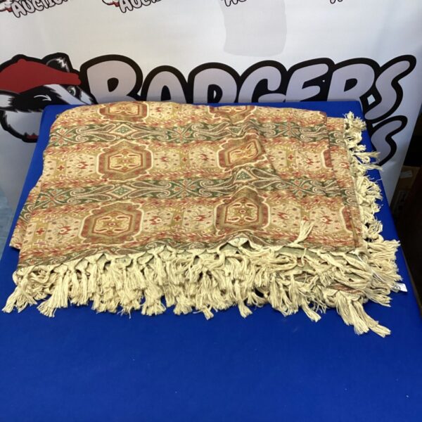Vintage floral jacquard bedspread with long fringe detailing.