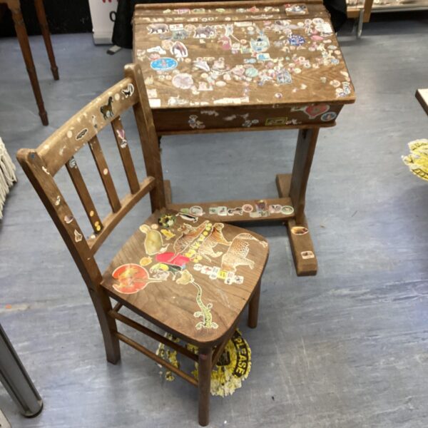 Colourful vintage school desk and chair set with illustrative decals.