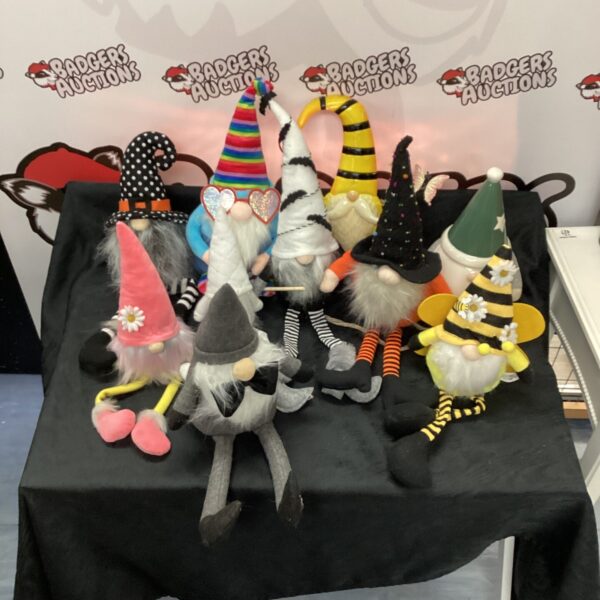 Group of vintage Gonk figures with colourful knitted hats.
