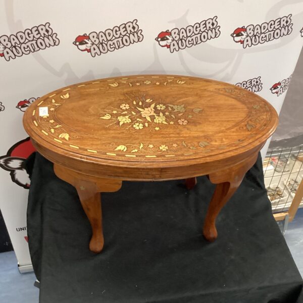 Antique inlaid occasional table with mahogany finish.
