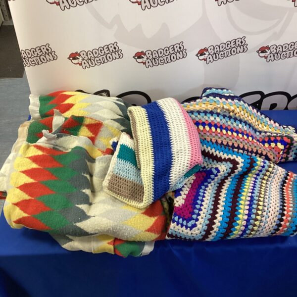 Colorful vintage woolen blankets in a lot.