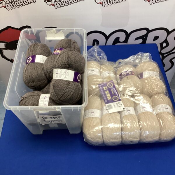 Cream and grey wool yarn lot for knitting and crochet projects.