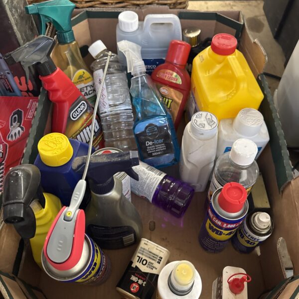 Tray of assorted house clearance chemicals and fluids.