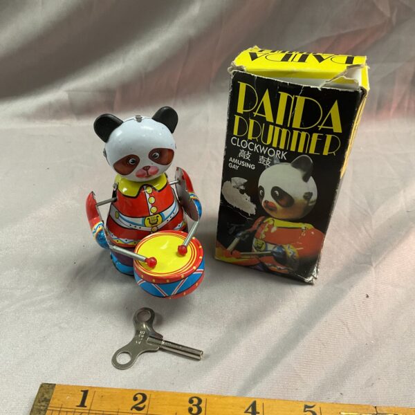 Vintage tin clockwork panda drummer toy with original box.