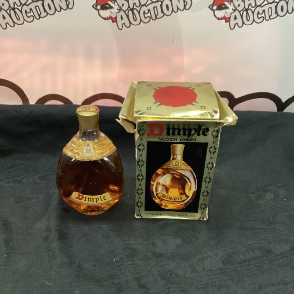 Vintage Dimple Scotch Whisky bottle with triangular shape.