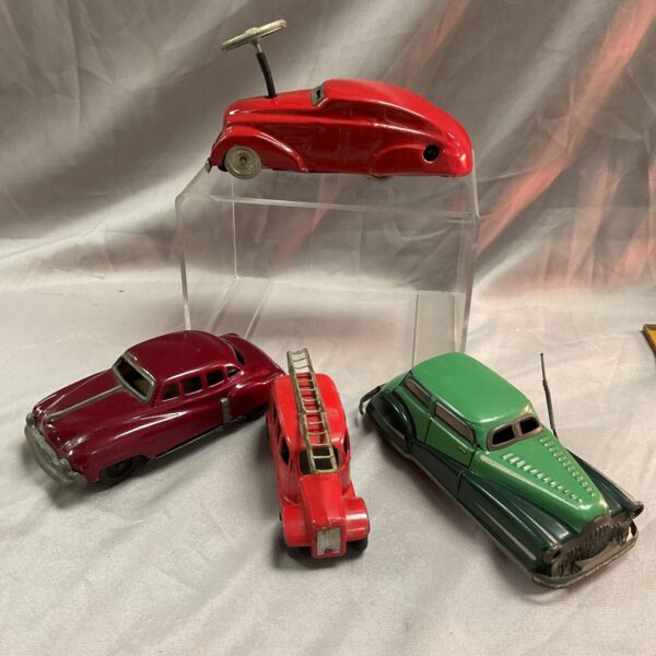 Lot of three vintage tin cars, including a Dinky fire engine.