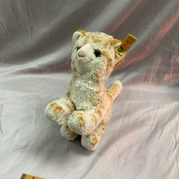 Vintage Steiff ginger kitten plush toy, side view.
