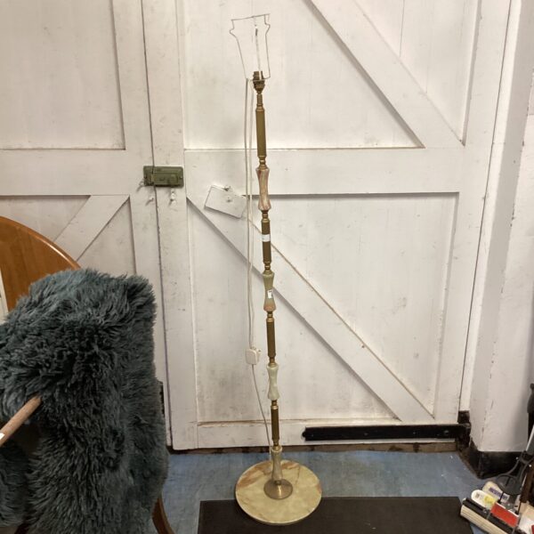Vintage brass and marble standard lamp for home lighting.