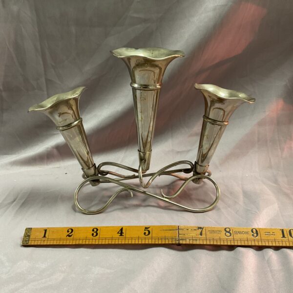 Antique silver plate epergne centrepiece with ornate detailing.