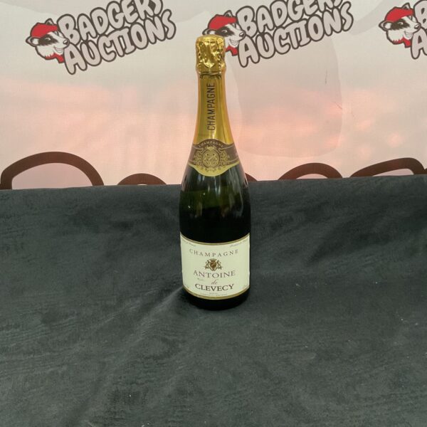 Sealed bottle of Antoine de Clevecy champagne, a collectible French sparkling wine.
