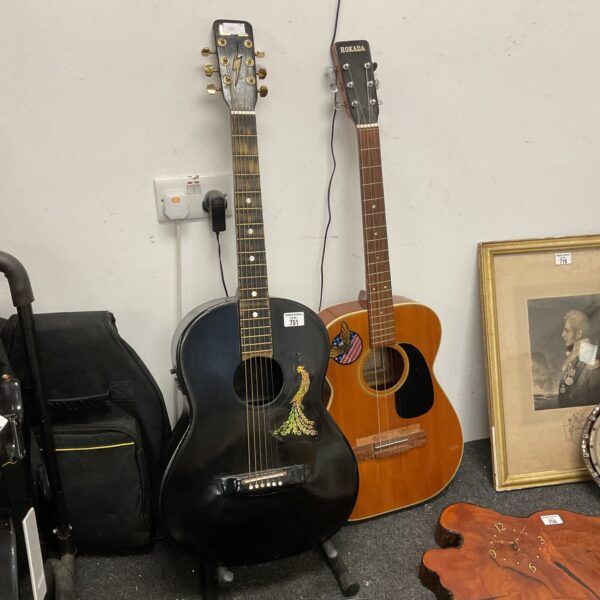Vintage Hokada acoustic guitar with a dark finish.