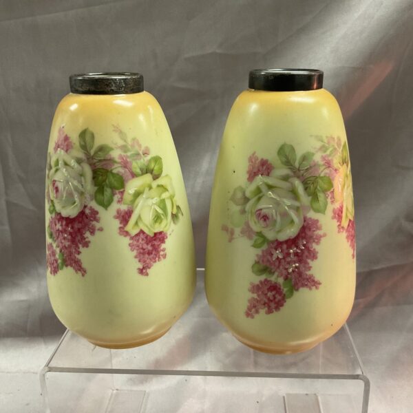 Antique hand-painted porcelain vases with silver rims, a charming pair.