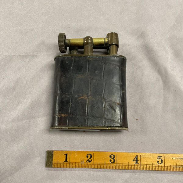 Vintage Art Deco crocodile skin table lighter, side view.
