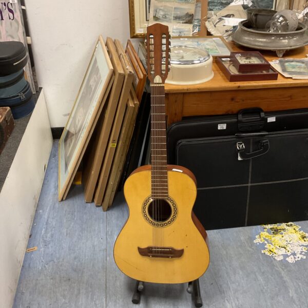 Vintage 12-string acoustic guitar in a vintage setting.