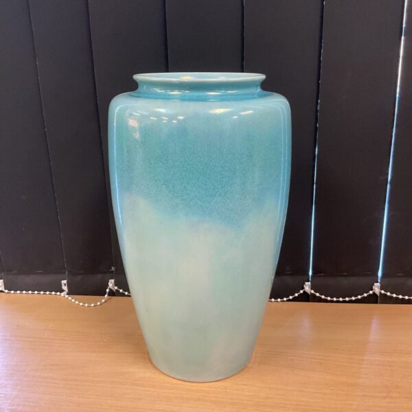 Vintage blue lustre vase with shimmering glaze.