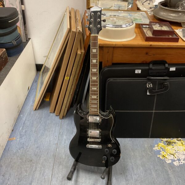 Front view of a black Marlin electric guitar in used condition.