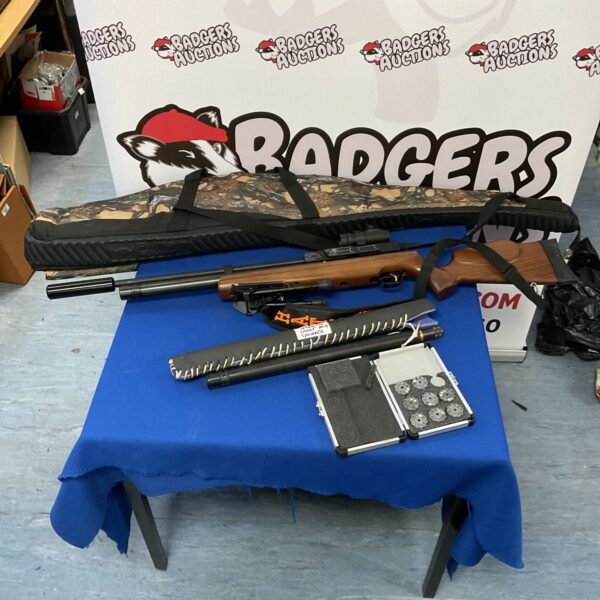Hatsan AT44-10 PCP air rifle in a hard case with accessories.