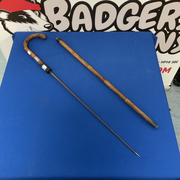Antique bamboo sword stick with sterling silver cuff detail.