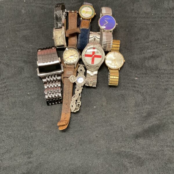 Mixed watch lot featuring Cartier style and digital timepieces.