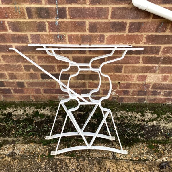 Geometric metal garden table legs for outdoor furniture.