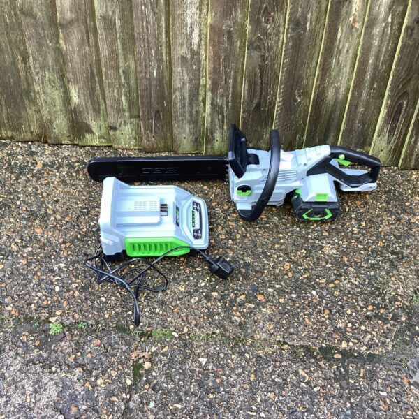 Go Battery Chainsaw with charger, cordless electric garden tool.
