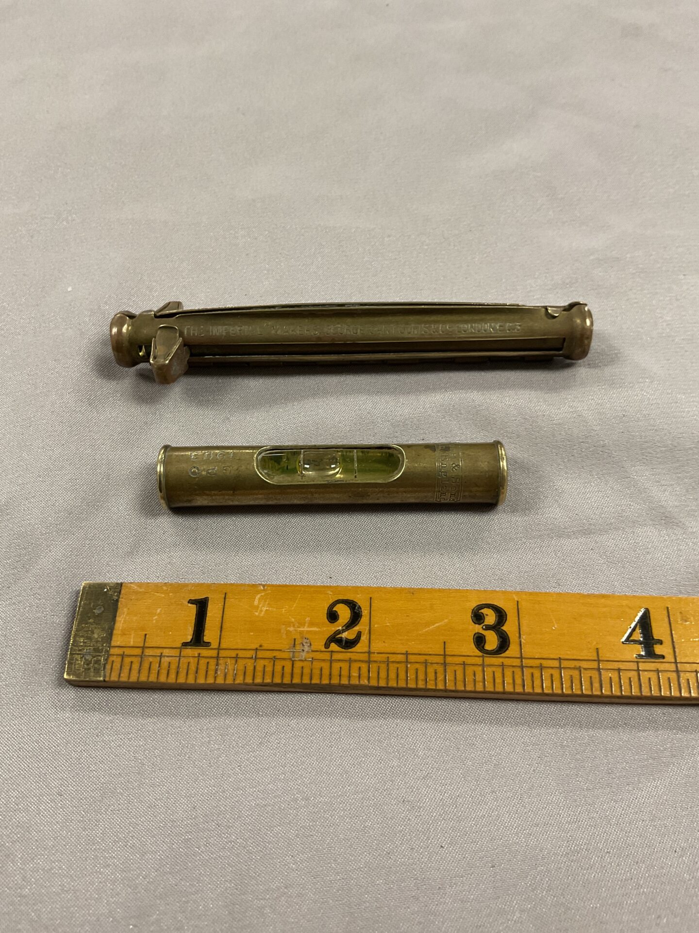 796 ‘The imperial’ Maker George cantuoris & Co tubular cigarette roller and small spirit level