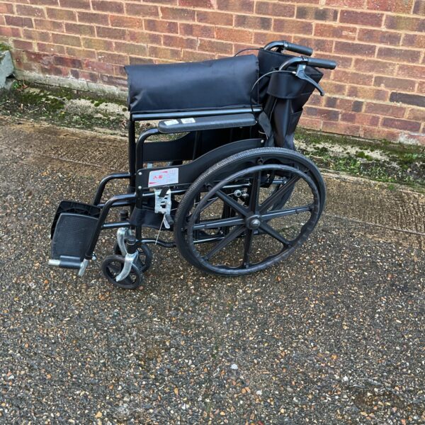 Black folding wheelchair, a used mobility aid.