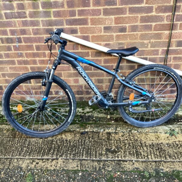 Blue Rockrider ST100 mountain bike for young riders.