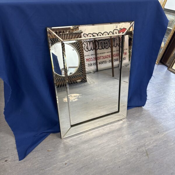 Silvered glass bevelled edge mirror for home decor.