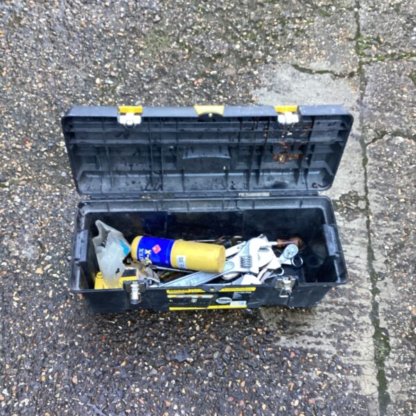 Open vintage Stanley tool box with tools inside.