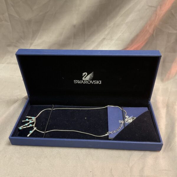 Sparkling Swarovski turquoise pendant necklace on a delicate chain.