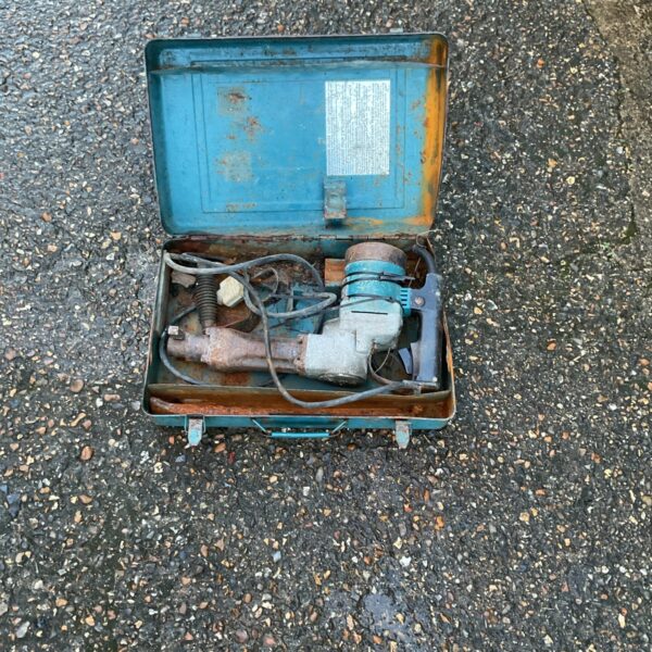 Vintage Makita 24v rotary hammer drill in open case.