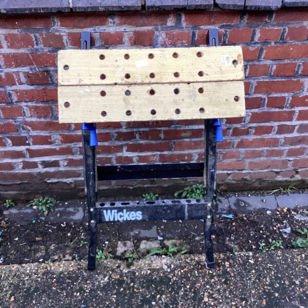 Wickes folding workbench showing wooden surface and metal legs.