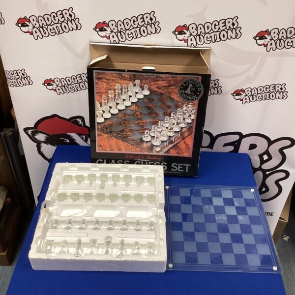 Glass chess set in original box, collectible vintage game.